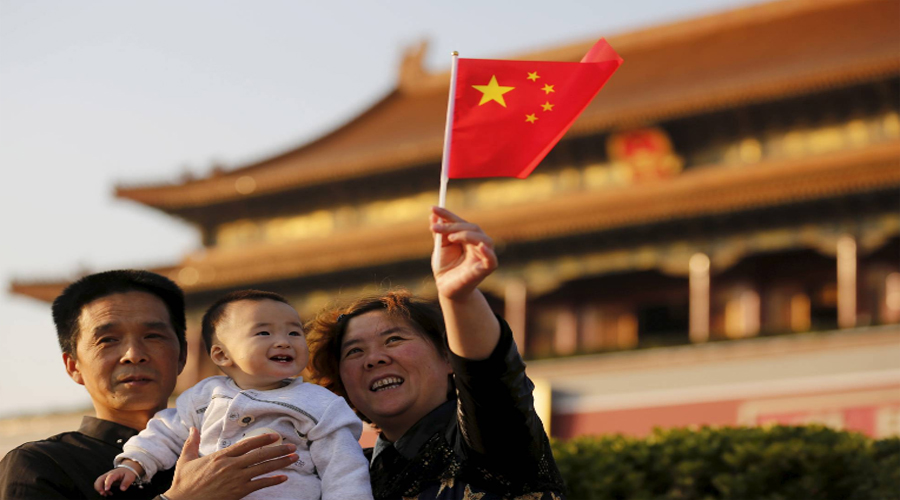 China moves to three-child policy to boost falling birth rate