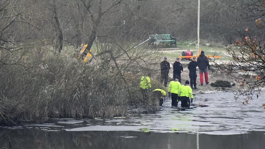 Three children killed after falling through ice at frozen lake in UK