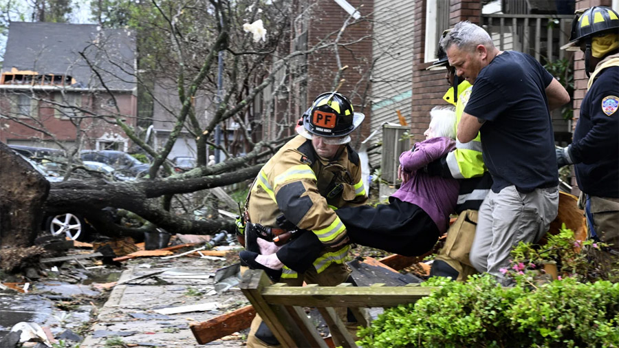 At least 22 killed and dozens hospitalized after violent storms and large tornadoes tore through the South and Midwest